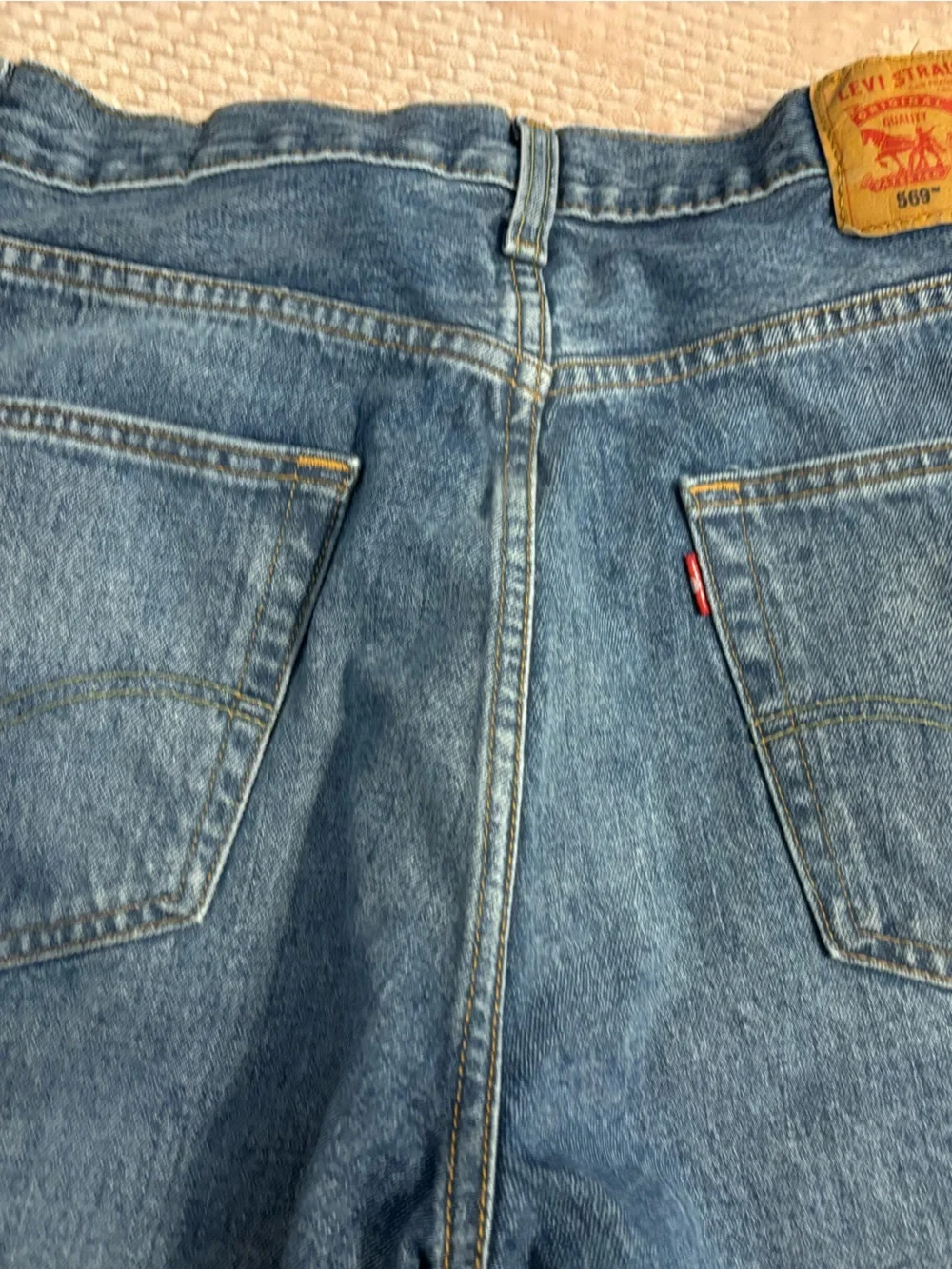 Levi's blue denim jean shorts 526 with tan leather patch